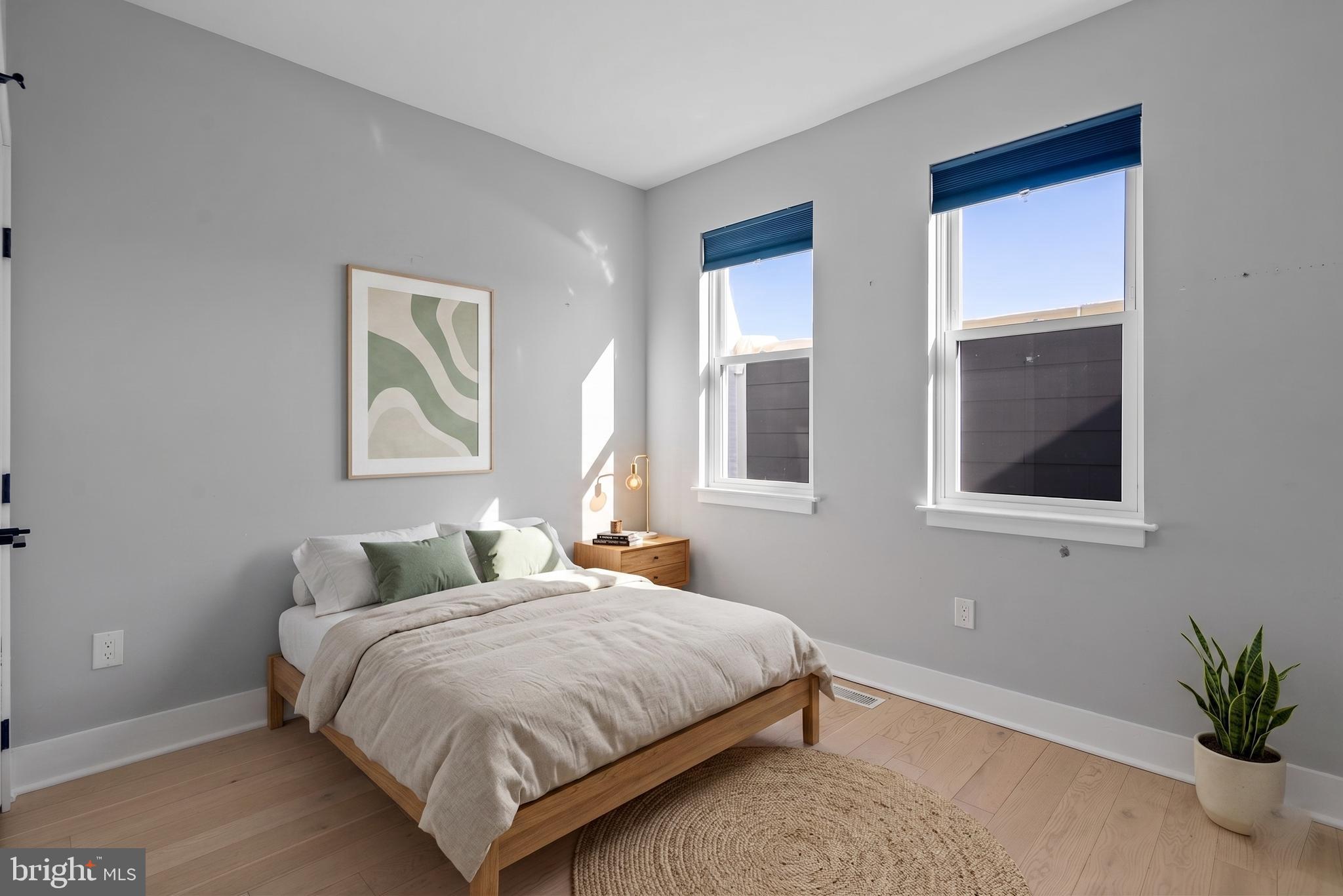 3572 13th Street Northwest, Unit 2 Washington, DC 20010 - Photo 16 of 26 a bedroom with a bed and a window