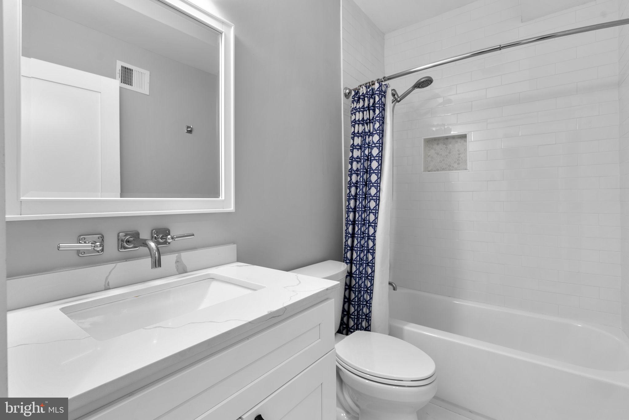 3572 13th Street Northwest, Unit 2 Washington, DC 20010 - Photo 20 of 26 a bathroom with a granite countertop sink a toilet and shower