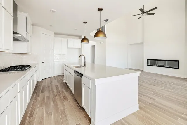a kitchen with a sink and a refrigerator