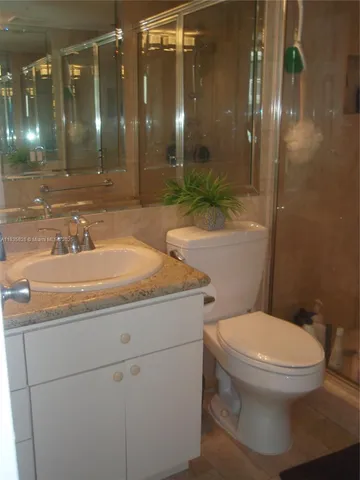 a view of a livingroom with wooden floor and closet