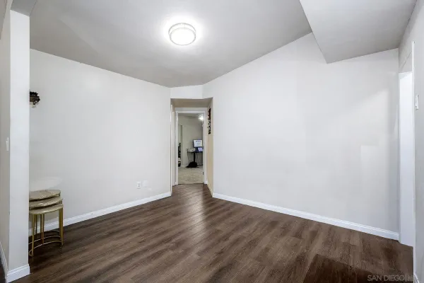 a spacious bedroom with a bed and a couch