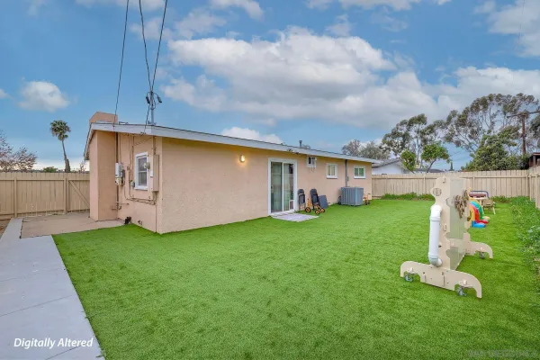 a patio with table and chairs