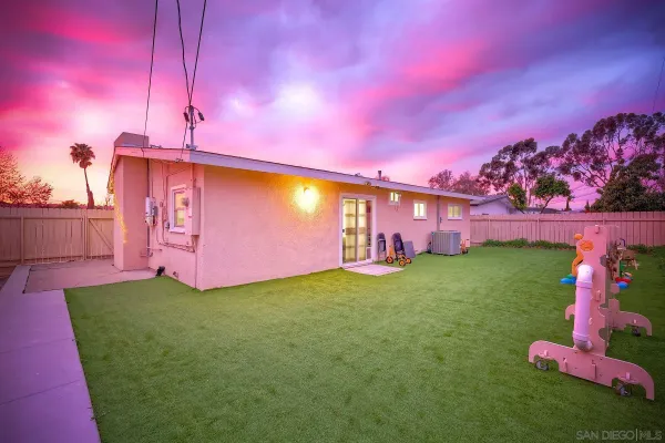a view of yard with swimming pool and green space
