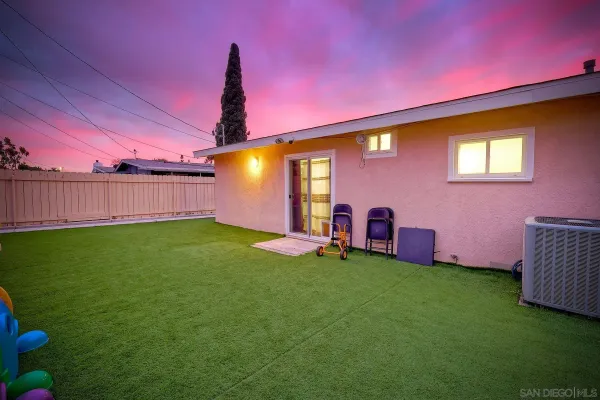 a view of yard with swimming pool and green space