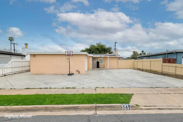 a view of a house with a yard and garage