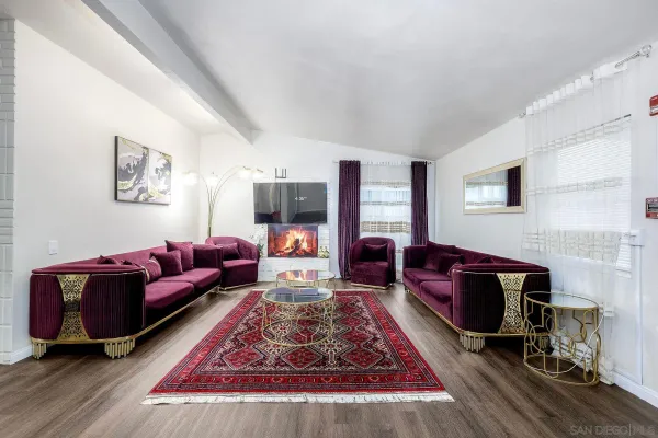 a living room with furniture a rug and a couch