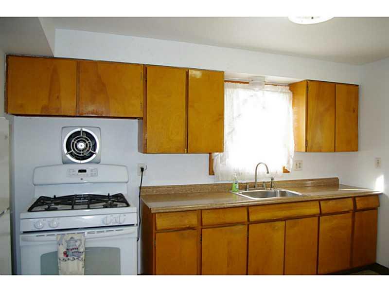 1170 Race Street McKees Rocks, PA 15136 - Photo 2 of 9 Kitchen. Kitchen features oak cabinets, gas stove and refrigerator for all you cooking needs.