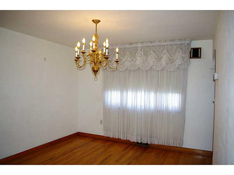 1170 Race Street McKees Rocks, PA 15136 - Photo 4 of 9 Dining Room. Formal dining room features plenty of natural light, neutral decor and hardwood floors.
