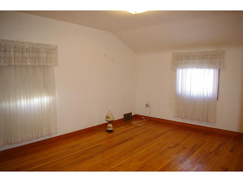 1170 Race Street McKees Rocks, PA 15136 - Photo 5 of 9 Bedroom. Master bedroom features a walk in closet and beautiful hardwood floors.