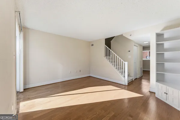 a view of entryway with wooden floor