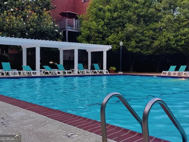 a front view of house with yard having seating