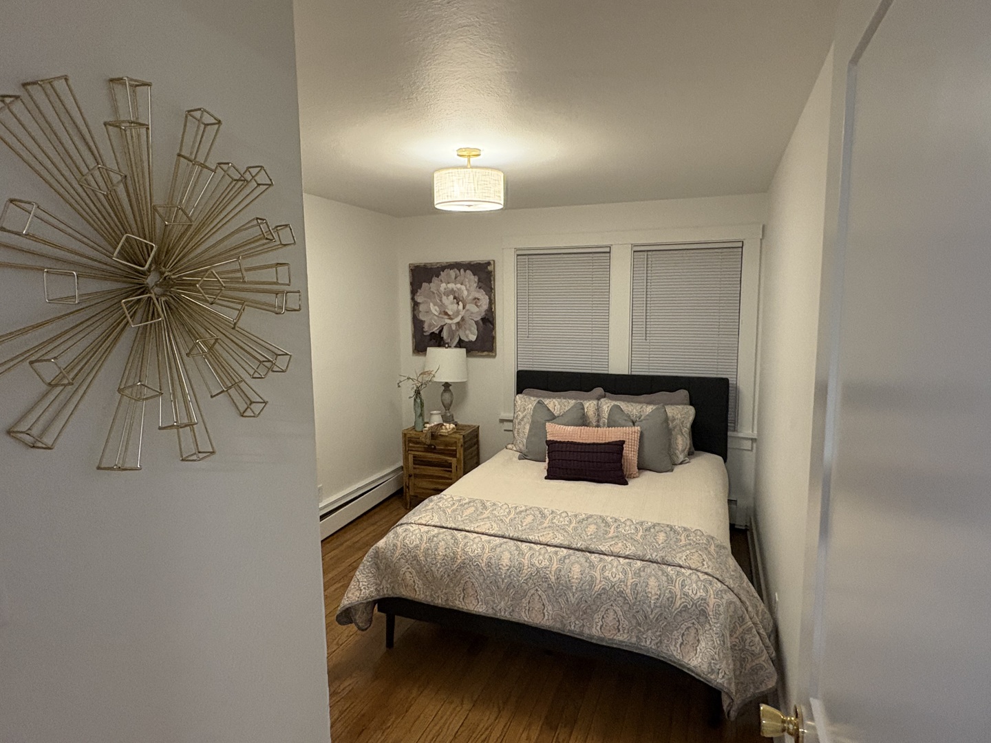 116 North 9th Street DeKalb, IL 60115 - Photo 7 of 20 a bedroom with a bed and a chandelier