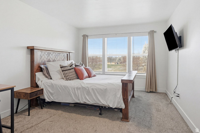 1247 West 1820th Street South Logan, UT 84321 - Photo 9 of 21 Primary Bedroom with natural light.