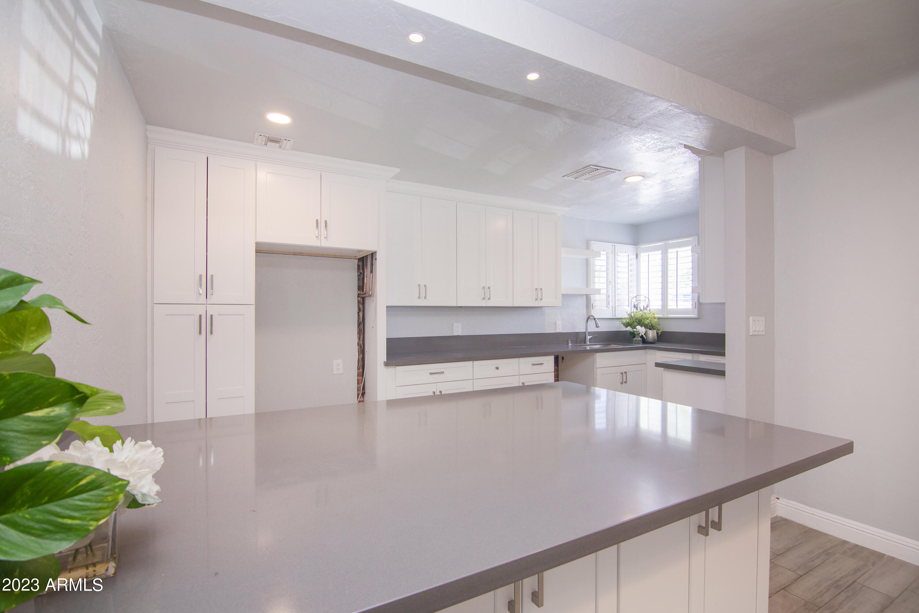 1318 East Granada Road Phoenix, AZ 85006 - Photo 13 of 38 a view of a kitchen with wooden floor