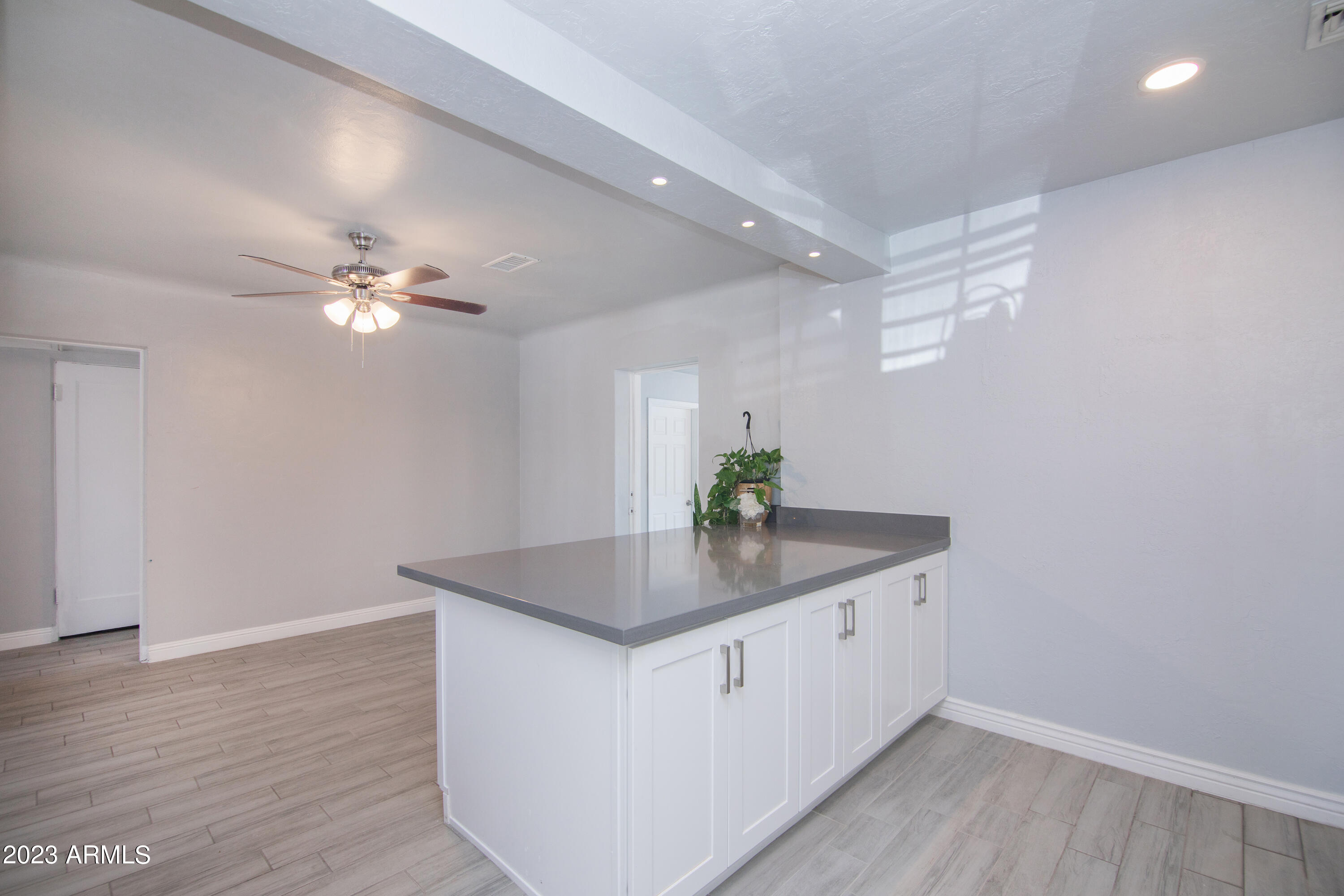 1318 East Granada Road Phoenix, AZ 85006 - Photo 20 of 38 a kitchen with a sink and chandelier