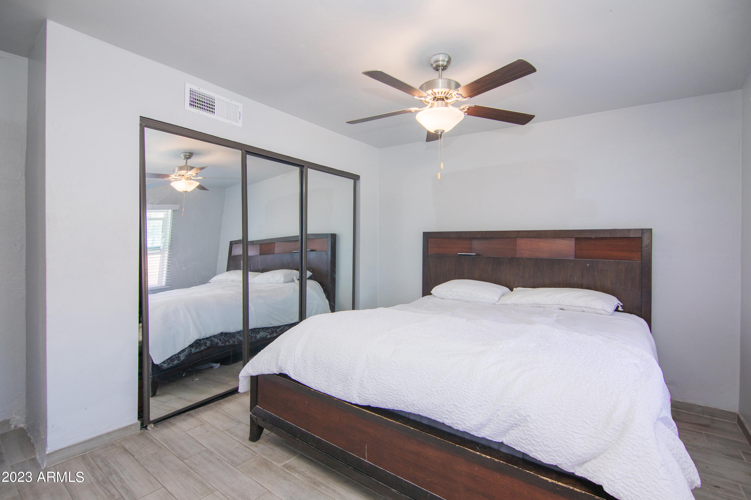 1318 East Granada Road Phoenix, AZ 85006 - Photo 24 of 38 a bedroom with bed and window