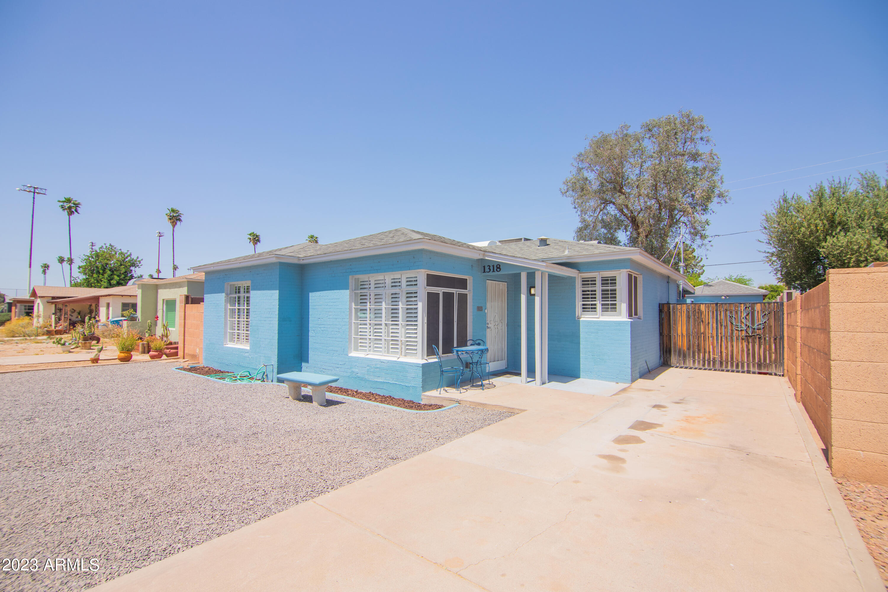 1318 East Granada Road Phoenix, AZ 85006 - Photo 3 of 38 a front view of a house with a yard and outdoor seating