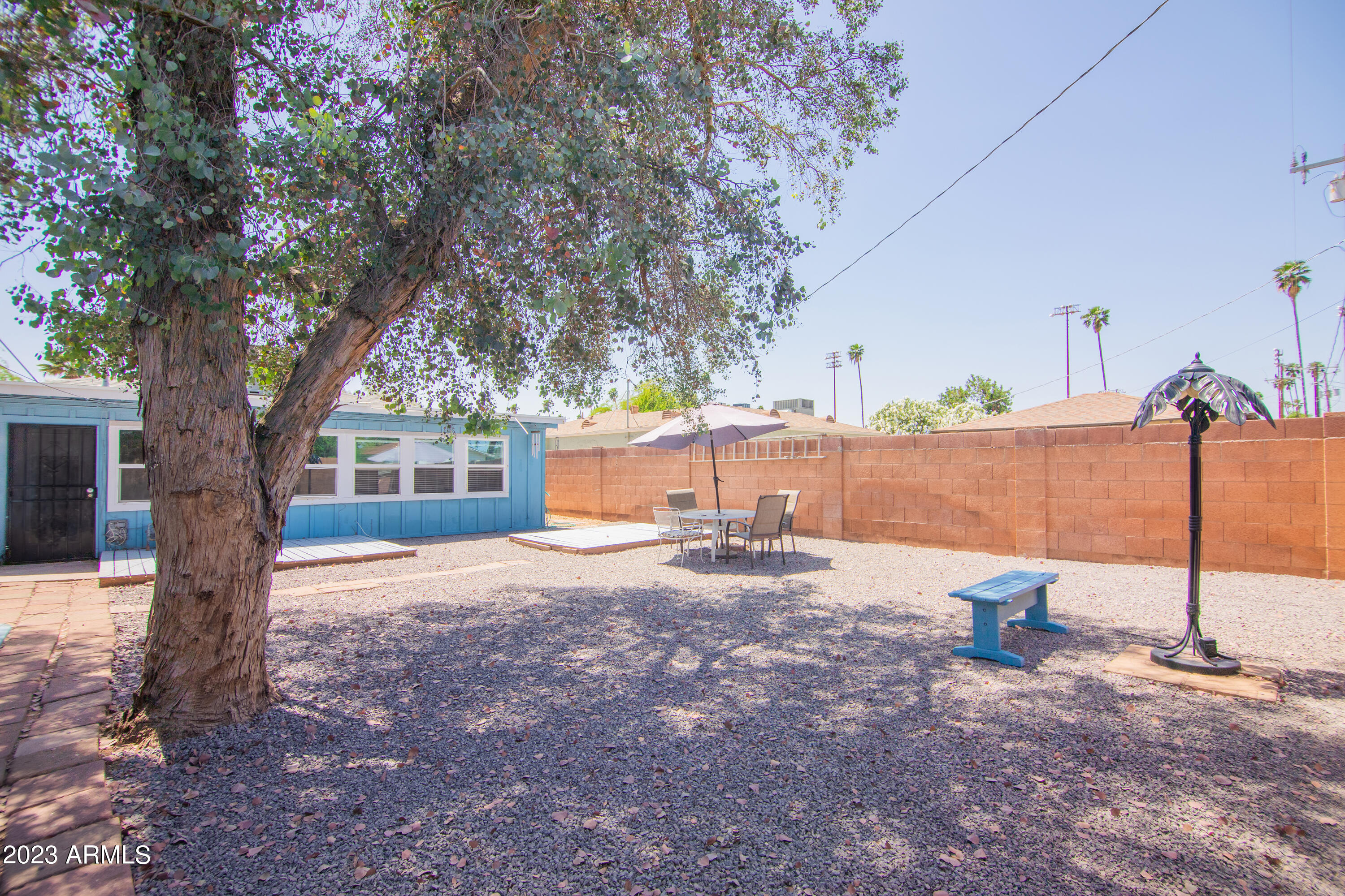 1318 East Granada Road Phoenix, AZ 85006 - Photo 36 of 38 a backyard of a house with a tree