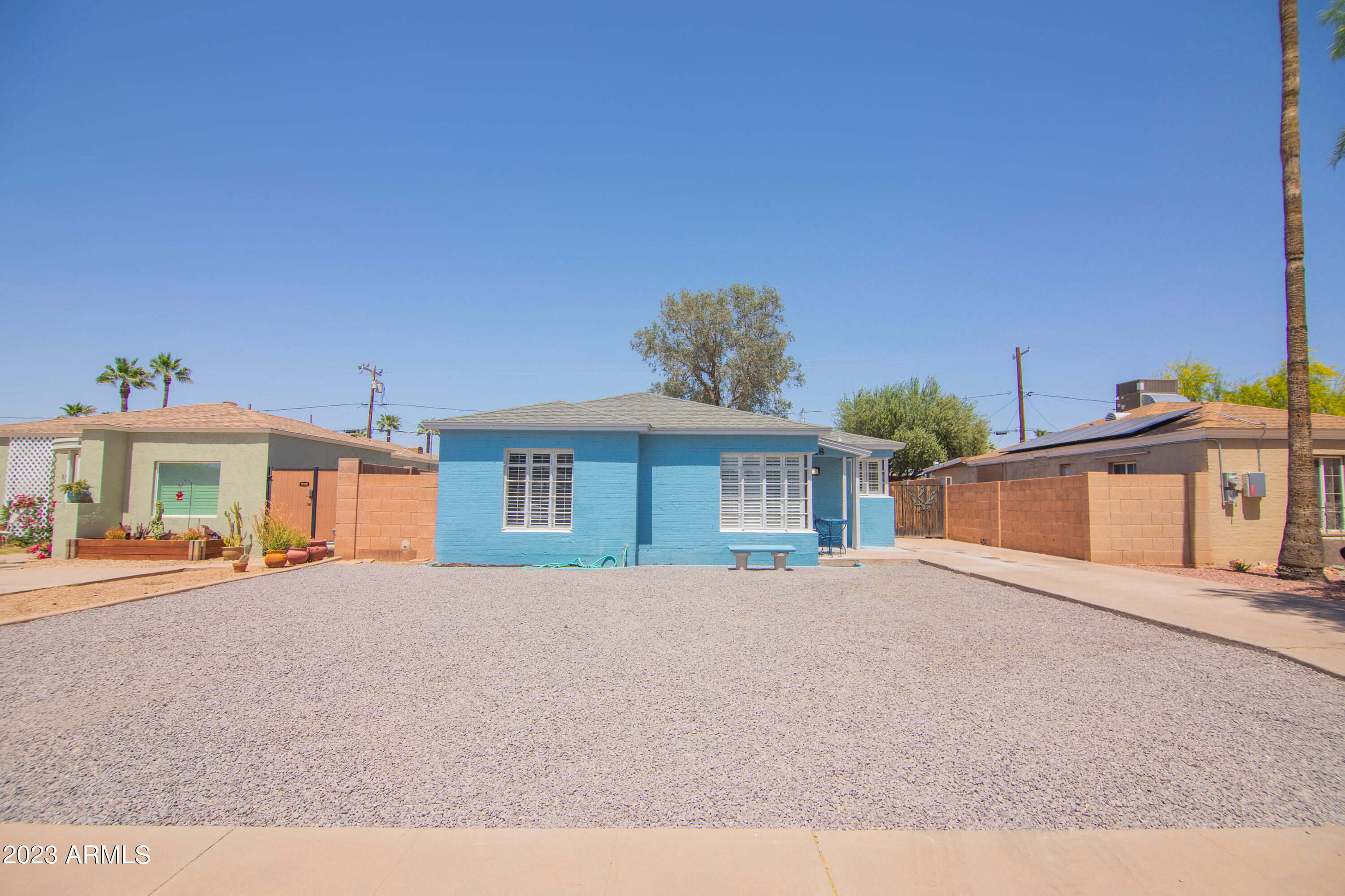 1318 East Granada Road Phoenix, AZ 85006 - Photo 5 of 38 a front view of a house with a yard