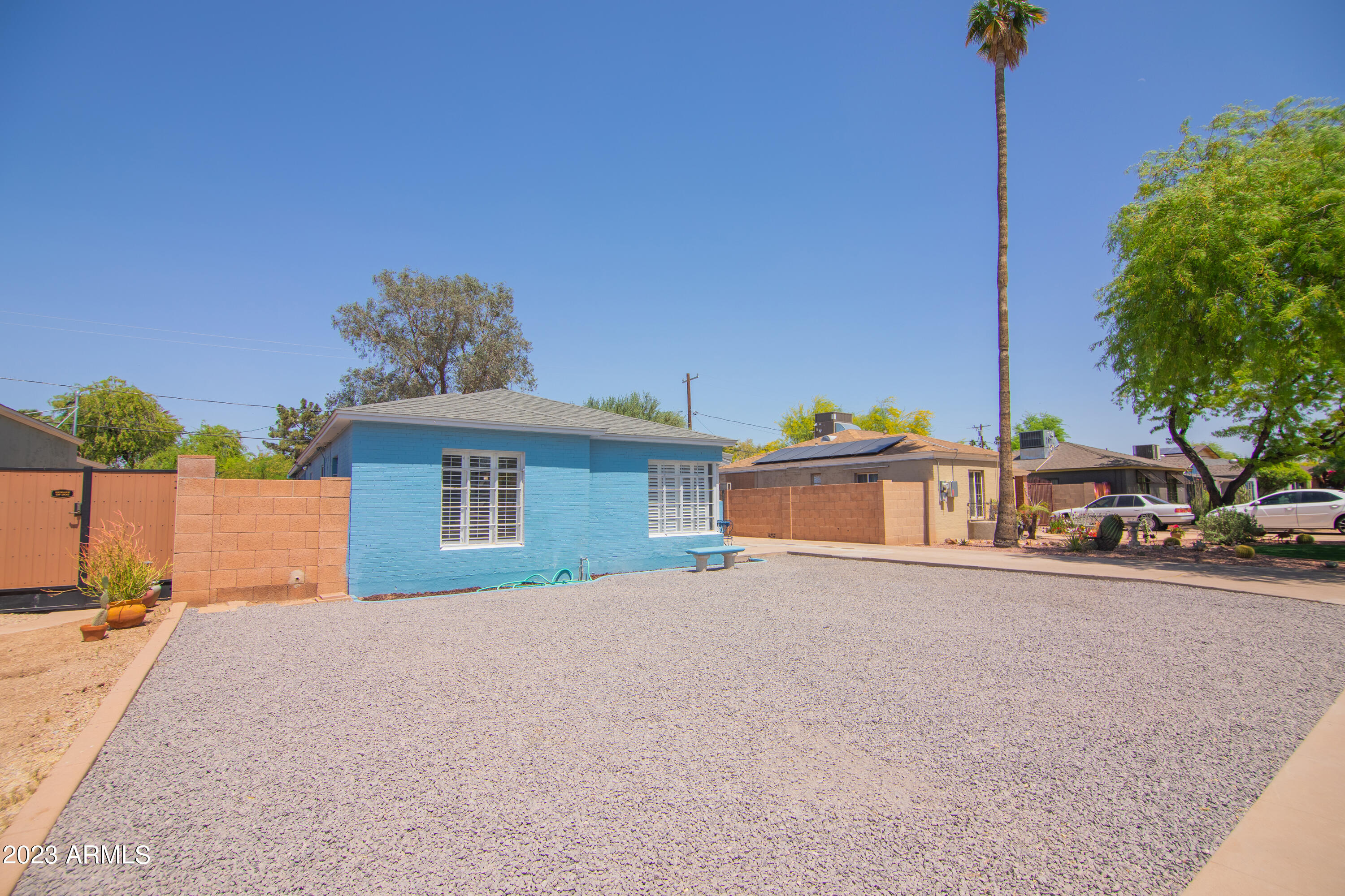 1318 East Granada Road Phoenix, AZ 85006 - Photo 6 of 38 a view of a house with a yard and potted plants