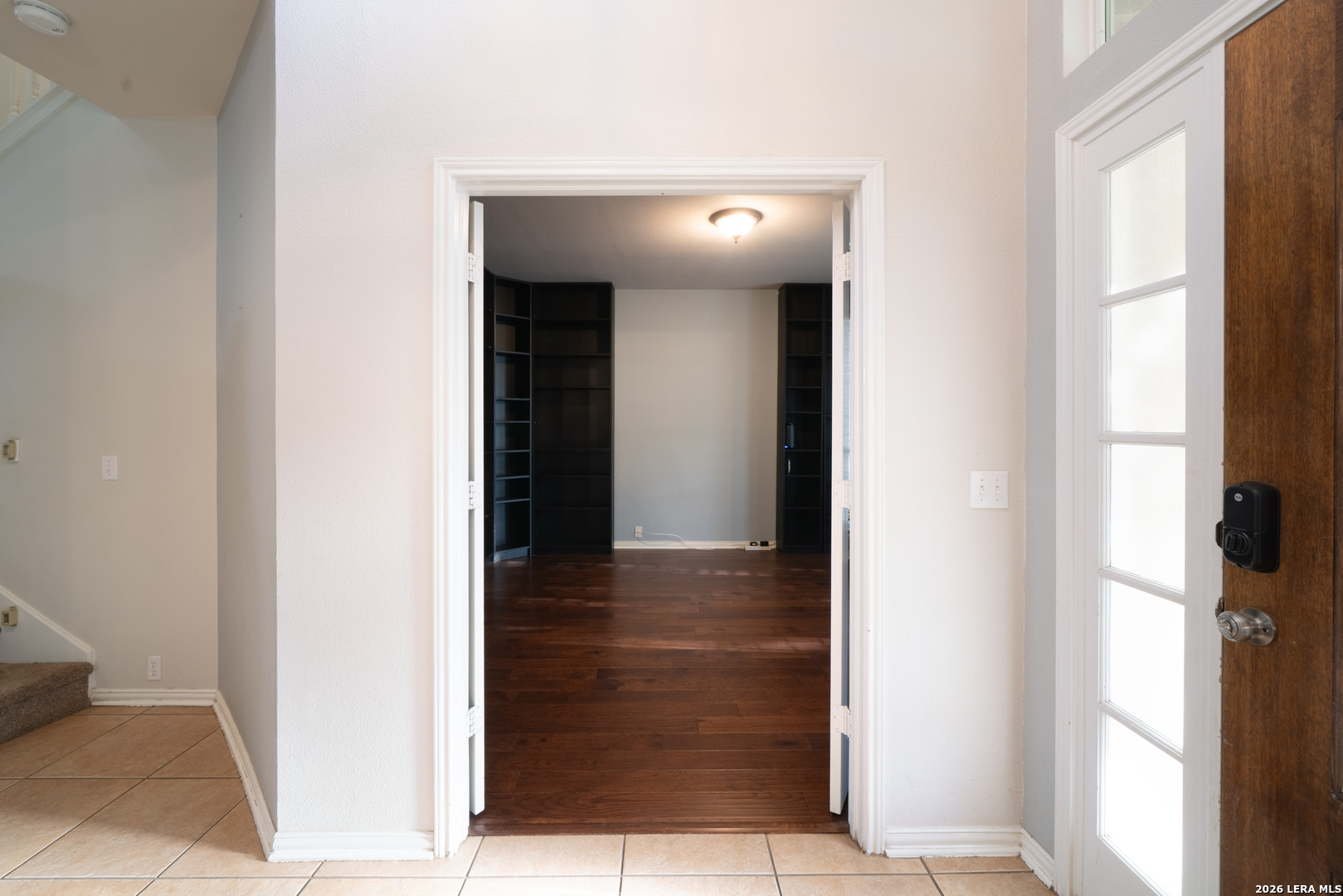 13034 Wild Heart Helotes, TX 78023 - Photo 17 of 49 a view of a hallway with wooden floor and entryway