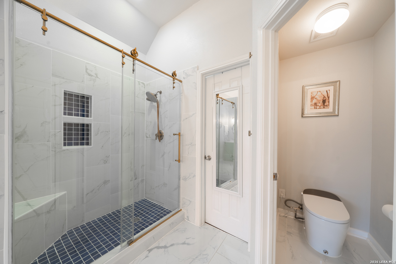 13034 Wild Heart Helotes, TX 78023 - Photo 23 of 49 a bathroom with a shower toilet and sink