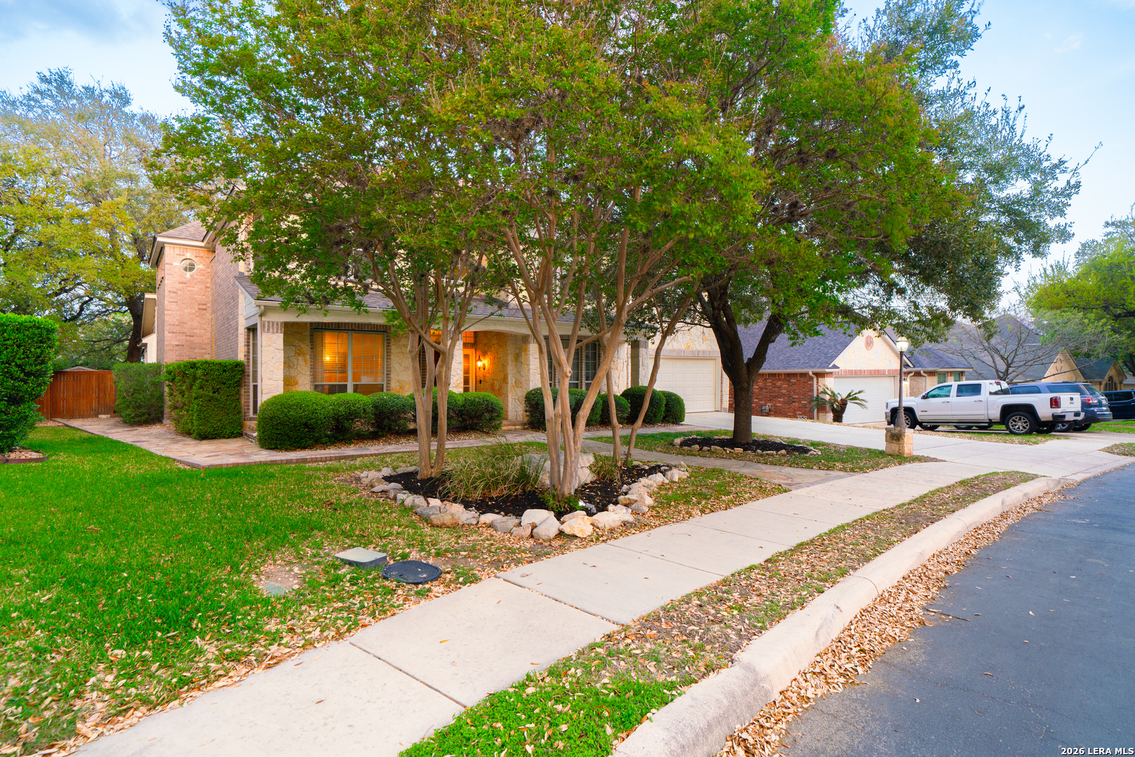 13034 Wild Heart Helotes, TX 78023 - Photo 3 of 49 a view of a house with a yard and tree s