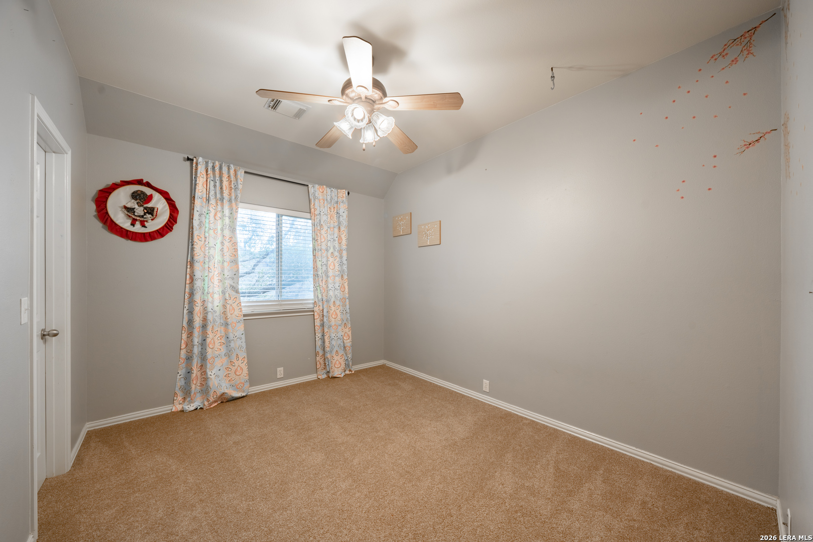 13034 Wild Heart Helotes, TX 78023 - Photo 31 of 49 an empty room with windows and fan