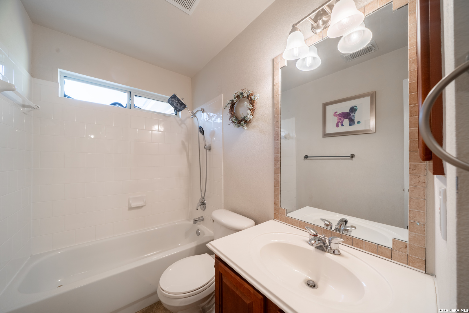 13034 Wild Heart Helotes, TX 78023 - Photo 32 of 49 a bathroom with a sink a toilet and shower