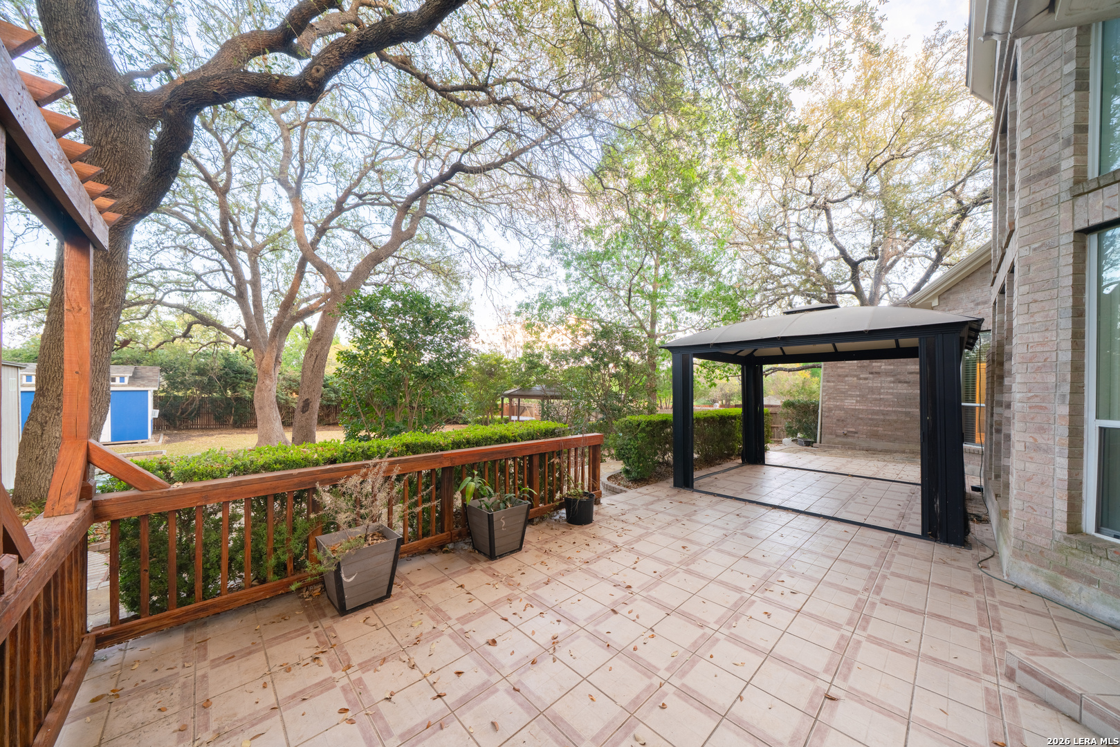 13034 Wild Heart Helotes, TX 78023 - Photo 37 of 49 a view of house with backyard and trees