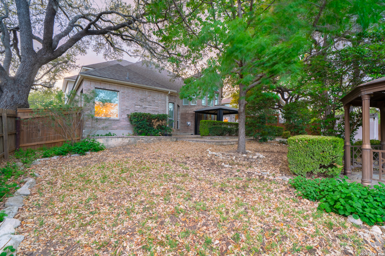 13034 Wild Heart Helotes, TX 78023 - Photo 42 of 49 a view of a house with a yard and tree s