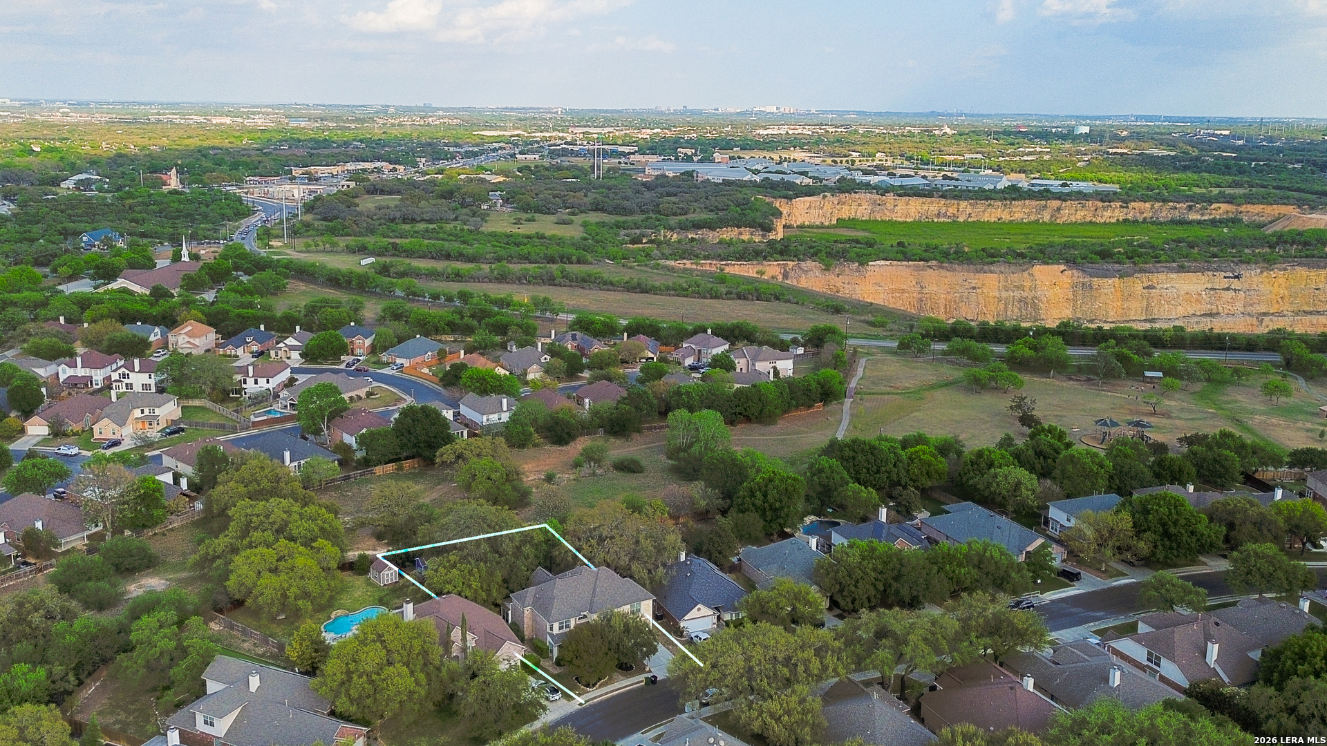 13034 Wild Heart Helotes, TX 78023 - Photo 48 of 49 a view of lake with residential houses with outdoor space and swimming pool