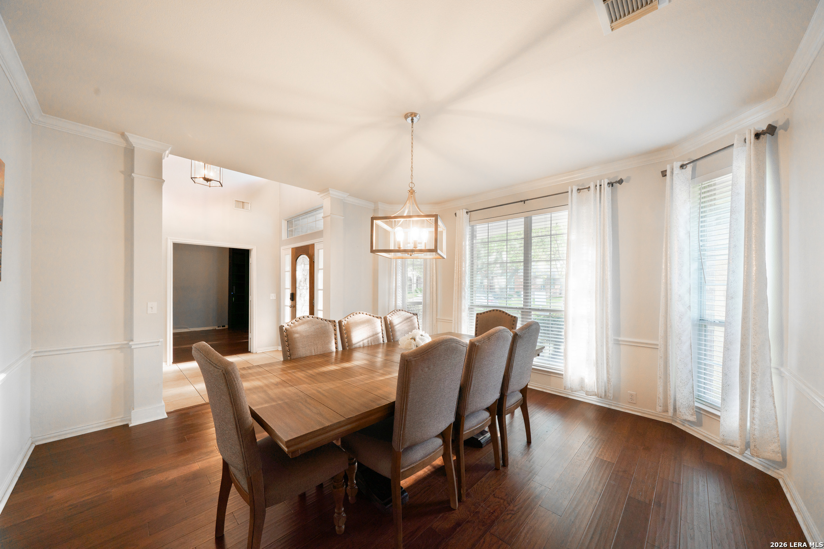 13034 Wild Heart Helotes, TX 78023 - Photo 6 of 49 a view of a dining room with furniture window and wooden floor
