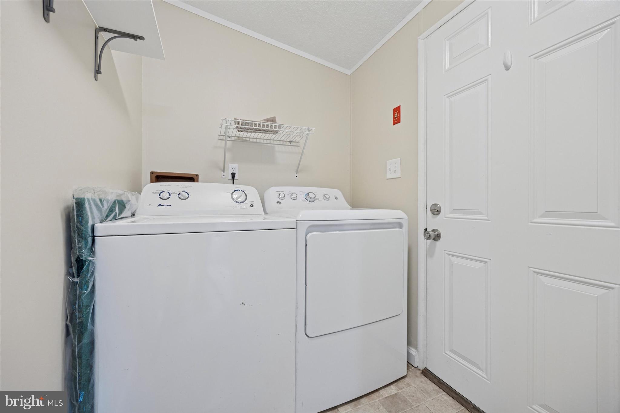 528 Vincent Lane, Unit 103 Bear, DE 19701 - Photo 15 of 16 Laundry Area with Door to Rear Yard