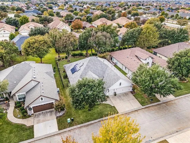 an aerial view of a house with a garden