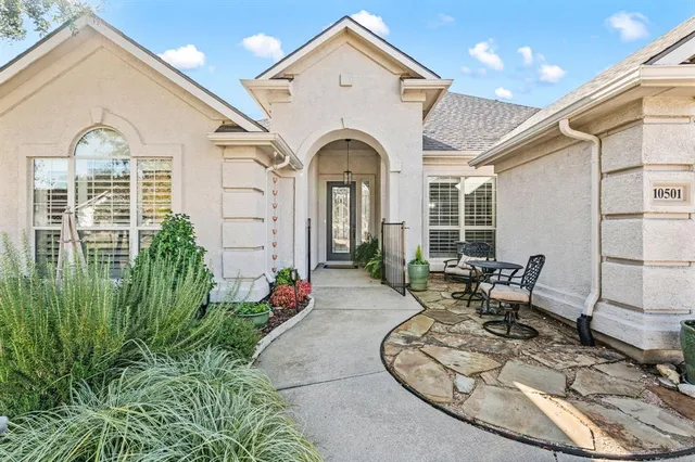 a view of a house with outdoor seating