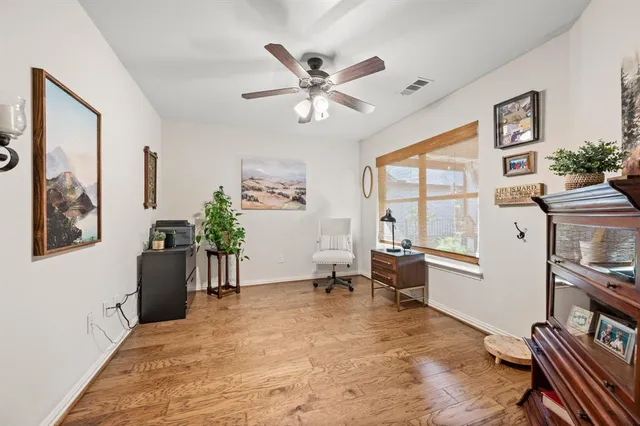 a work room with furniture and windows