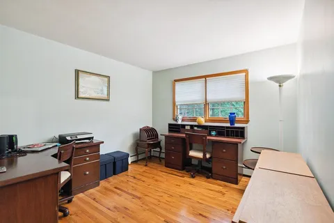 a bed room with a bed and a television