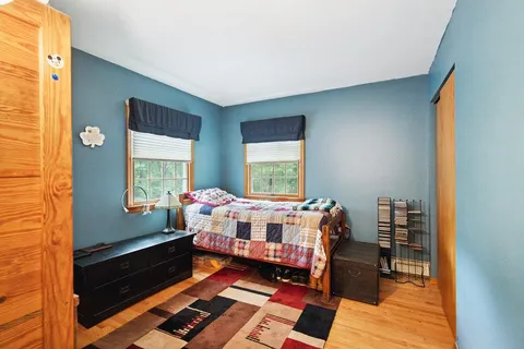 a bed room with a bed and a window