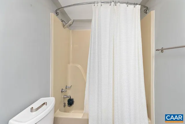 a bathroom with a shower curtain
