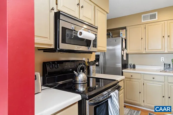 a kitchen with a stove and a microwave