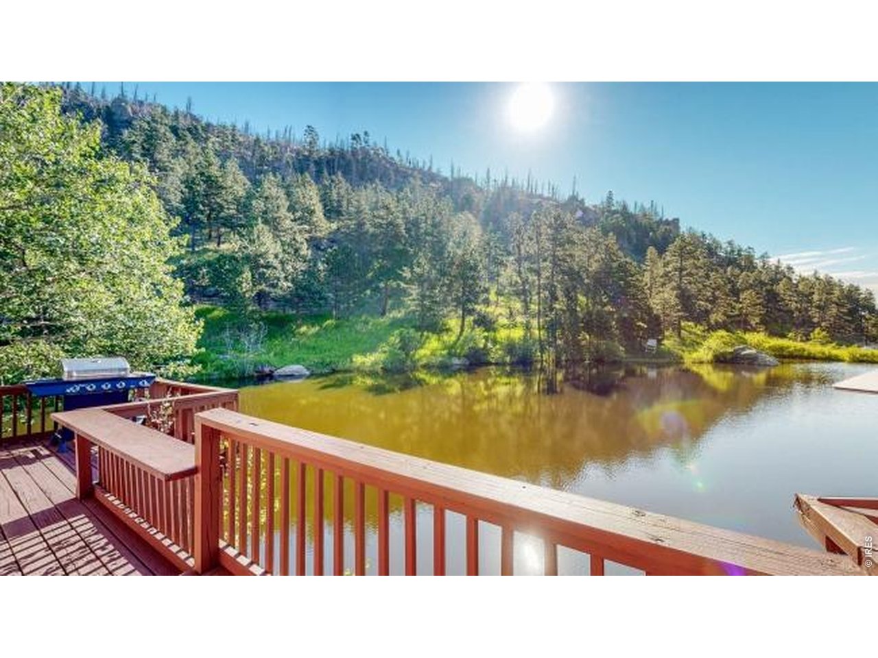 1268 Spring Valley Road Bellvue, CO 80512 - Photo 3 of 33 a balcony with an outdoor space and lake view