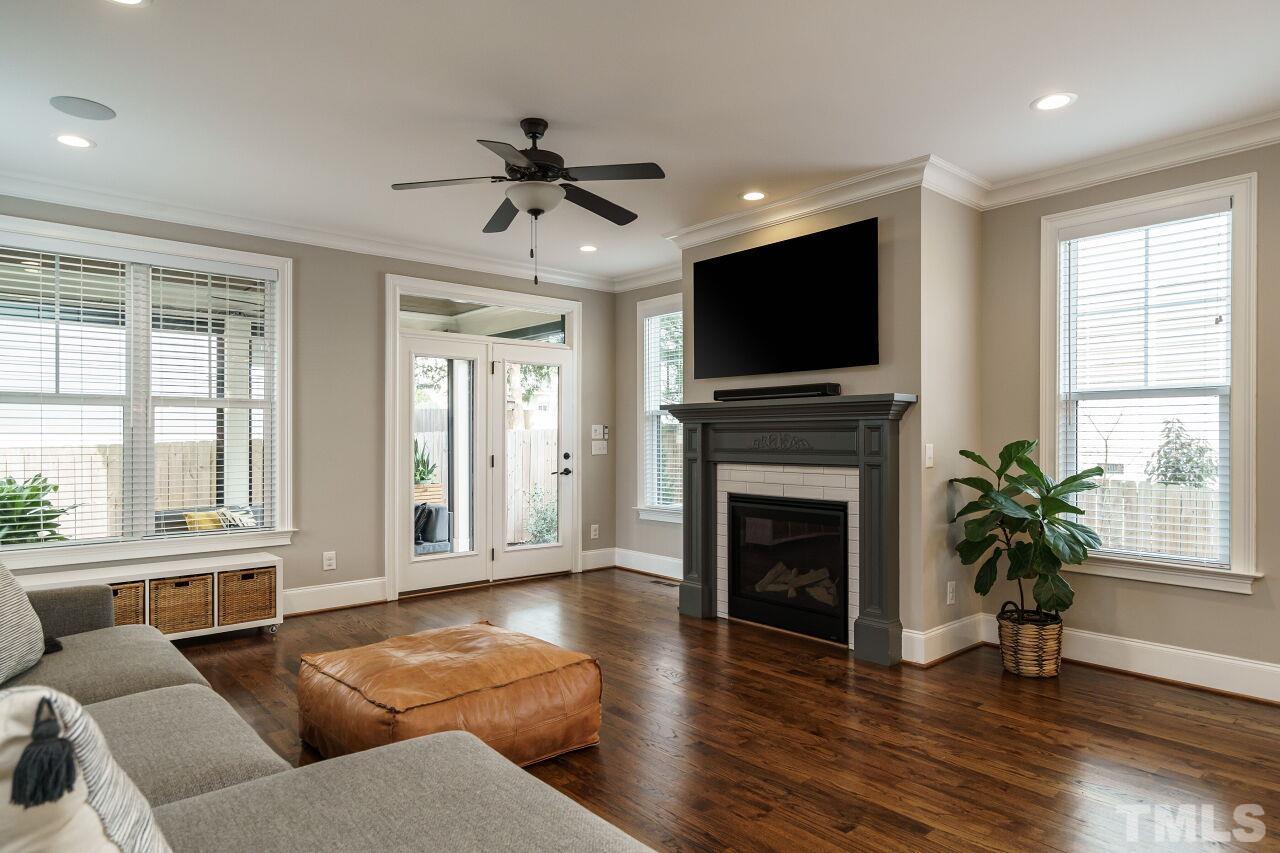 203 Georgetown Road Raleigh, NC 27608 - Photo 4 of 35 a living room with furniture fireplace and flat screen tv