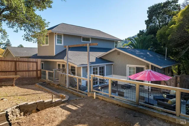 a bedroom with a large bed and a flat tv screen