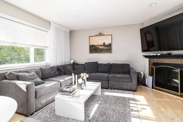 a bathroom with a granite countertop sink a toilet and a bathtub