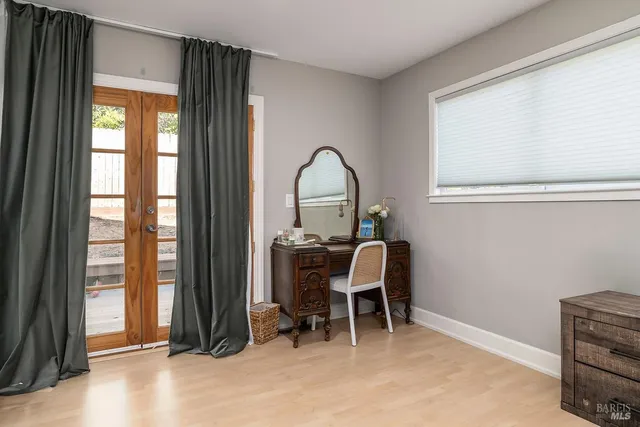 a wooden bench sitting in front of a house