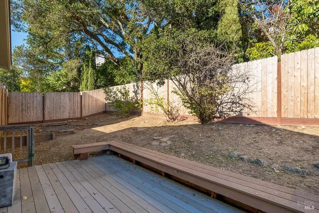 a kitchen with stainless steel appliances kitchen island granite countertop a sink and cabinets
