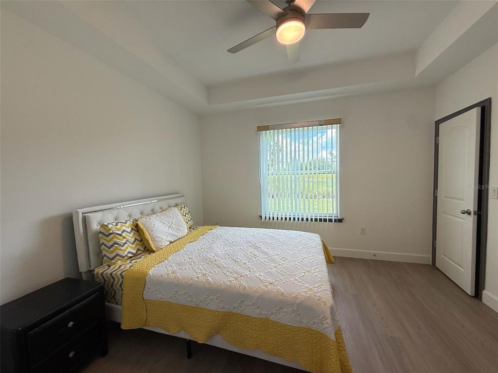 2050 Florida Development Road, Unit B Davenport, FL 33837 - Photo 11 of 16 a bedroom with a bed and window