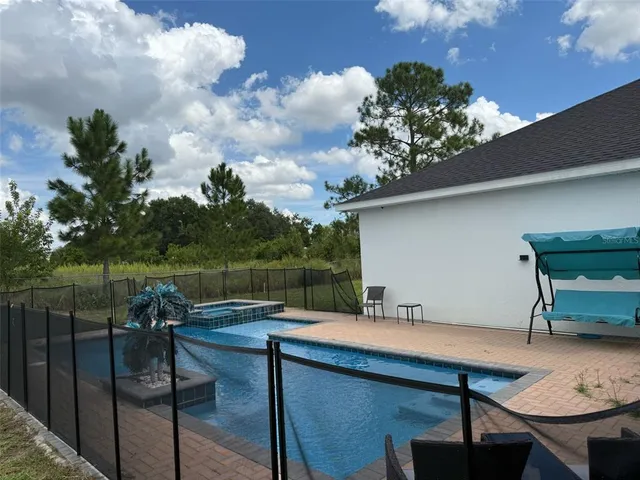 a terrace with outdoor seating and lake view