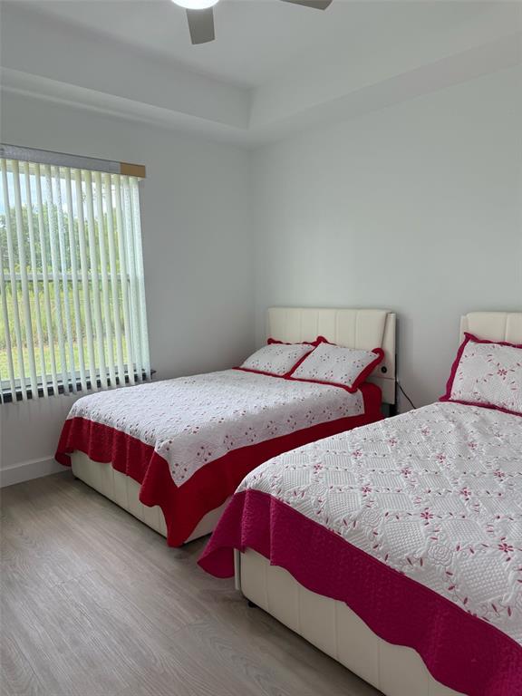 2050 Florida Development Road, Unit B Davenport, FL 33837 - Photo 16 of 16 a bedroom with two beds and a window